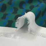 Viscose printed with a unique parenthesis, khaki background