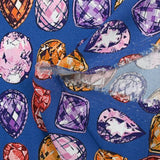 Viscose crepe with precious stone print, royal blue background