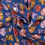Viscose crepe with precious stone print, royal blue background