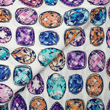 Viscose crepe with precious stone print on white background