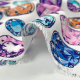 Viscose crepe with precious stone print on white background