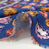 Viscose crepe with precious stone print, royal blue background