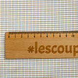 Dyed-woven cotton poplin with brown checks and white background