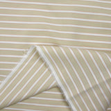 Red striped dyed cotton poplin, sand background