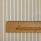 Red striped dyed cotton poplin, sand background