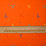 Cotton sports print with orange background