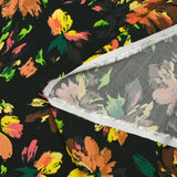 Viscose printed with squiggles of flowers on a black background