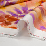 Viscose satin with blurred floral print on a blush background
