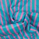 Double-sided quilted cotton with pink and turquoise stripes per meter