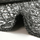 Silver quilted black background