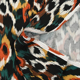 Viscose satin printed Venus burnt orange black background