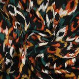 Viscose satin printed Venus burnt orange black background