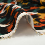 Viscose satin printed Venus burnt orange black background