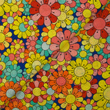 Algodón estampado flower power coral con fondo azul royal
