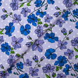 Cotton poplin printed climbing flowers with purple polka dot background