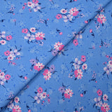 Cotton poplin printed bouquet in the clouds cornflower blue background