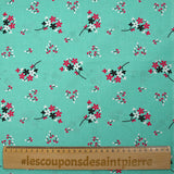 Cotton poplin printed with floral breath on aqua background