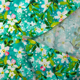 Jasmine printed cotton poplin with turquoise background