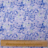 Cotton poplin printed with forget-me-not clouds, lavender background