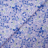 Cotton poplin printed with forget-me-not clouds, lavender background