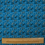 Cotton poplin printed with floral gesture on a petrol blue background