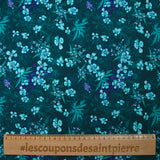 Cotton poplin printed with turquoise flowers on a dark blue background