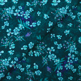 Cotton poplin printed with turquoise flowers on a dark blue background