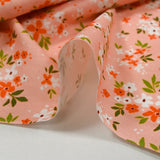 Cotton poplin printed floral composition peach pink background