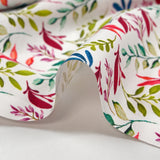 Cotton poplin printed with colorful foliage on white background