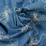 Lucie embroidered cotton chambray denim background