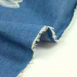 Anaïs embroidered cotton chambray denim background