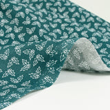 Cotton poplin printed holly green background