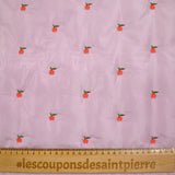 Matelassé pommes brodées fond mauve