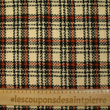 Burnt orange tartan wool tweed sand background