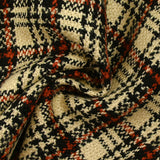 Burnt orange tartan wool tweed sand background