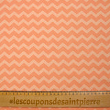 Jersey de coton imprimé chevrons fond pêche blanche