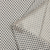Cotton jersey with dotted diamond print on ecru background