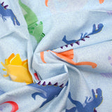 Cotton dinosaur print with sky background