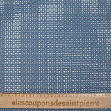 Punto de algodón estampado círculos y medias lunas carro fondo azul