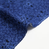 Cotton poplin printed with floral garden on a navy blue background