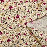 Cotton poplin printed with burgundy and beige flowers on an ecru background