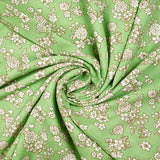 Off-white spring printed viscose with light green background