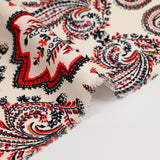 Coral cashmere-style printed crepe with ecru background