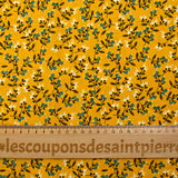 Cotton poplin printed with blue flower shoot and sunny yellow background