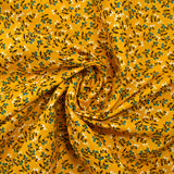 Cotton poplin printed with blue flower shoot and sunny yellow background