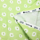 Double gaze imprimée marguerite smiley fond vert pomme