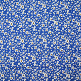 Viscose printed with white and yellow flowers, blue background