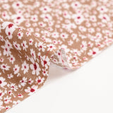 Viscose printed with white and burgundy flowers, hazelnut background