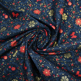 Popeline de coton imprimée poinsettias et nœuds rouge fond bleu marine
