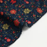 Popeline de coton imprimée poinsettias et nœuds rouge fond bleu marine